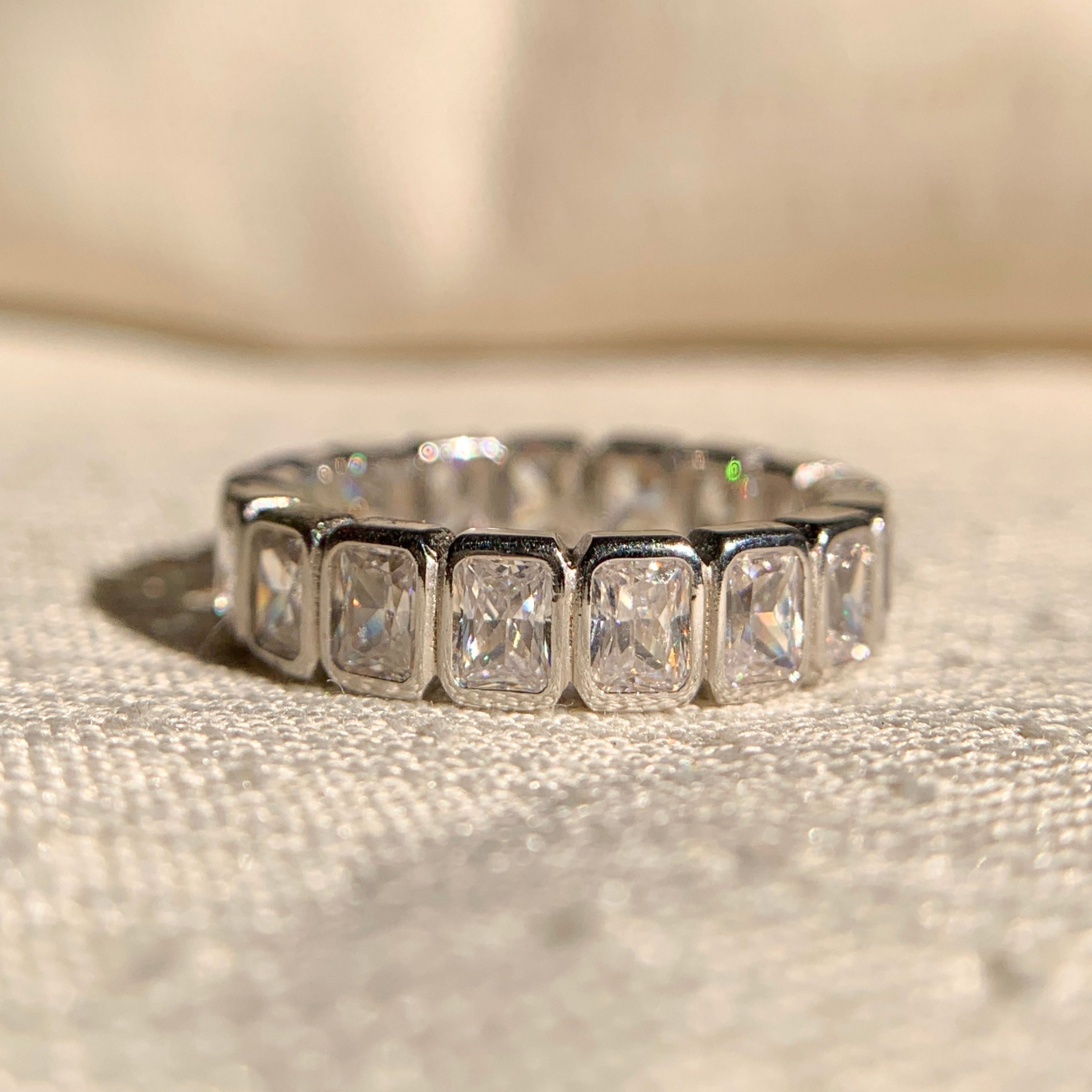 Radiant cut bezel set wedding band in white gold for elegant engagement